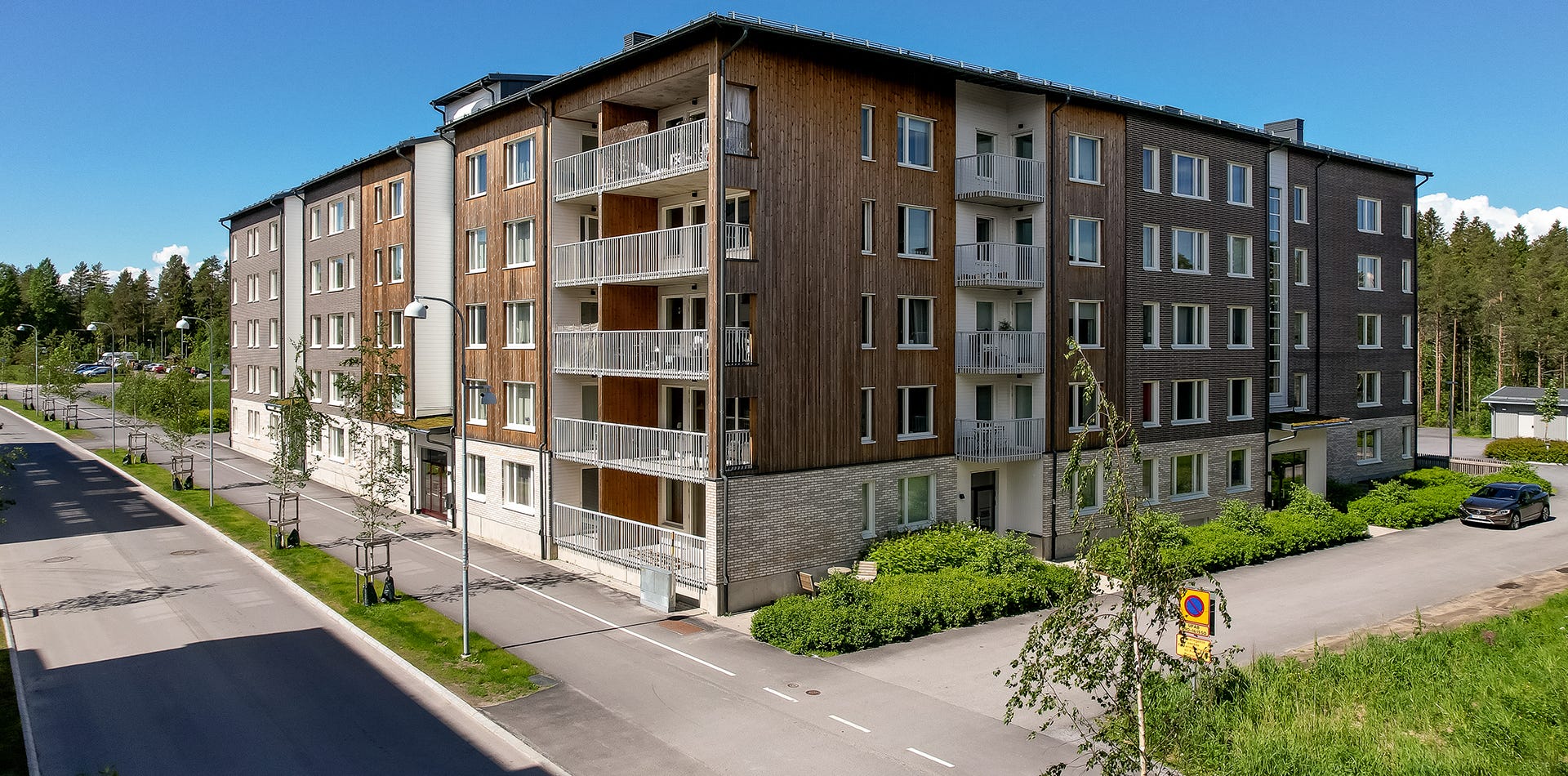 Foto på fasaden i trä och tegel i grannskapet Tillsammans