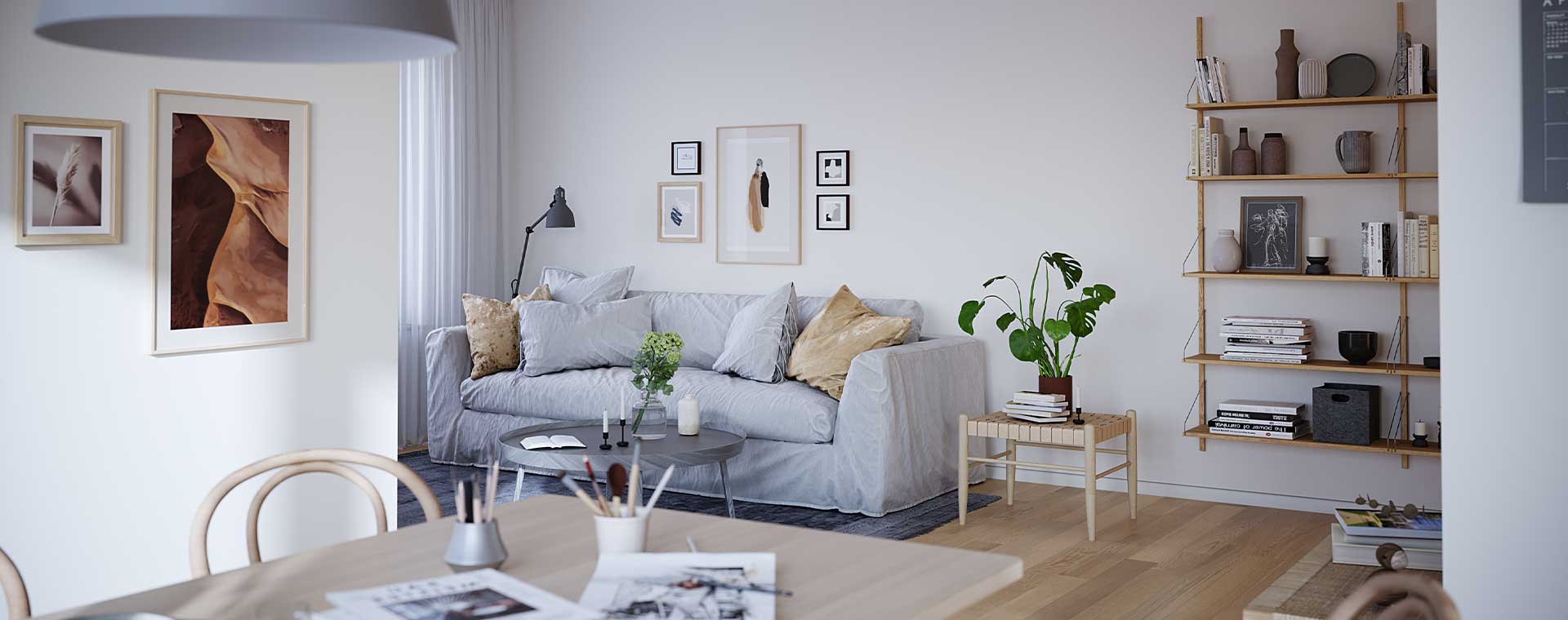 Nyproduktion i Partille - vardagsrum med soffa, tavlor och matbord